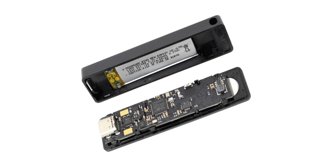 Hardware of a Ledger Nano X cold wallet with storage and security chips, microchip and connected USB port.